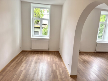 Wohnbereich - Citynah & ruhig – 1,5-Zimmer-Wohnung mit Grünblick an der U3