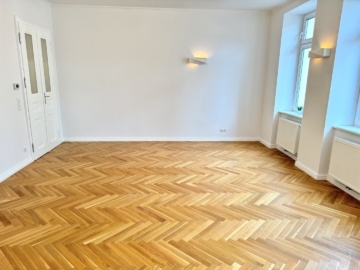 Wohnzimmer - Klassischer Charme trifft moderne Eleganz! Stilvolle Eckwohnung im klassischen Wiener Altbau in 1150 Wien